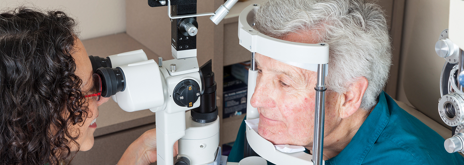 Senior man getting an eye exam.