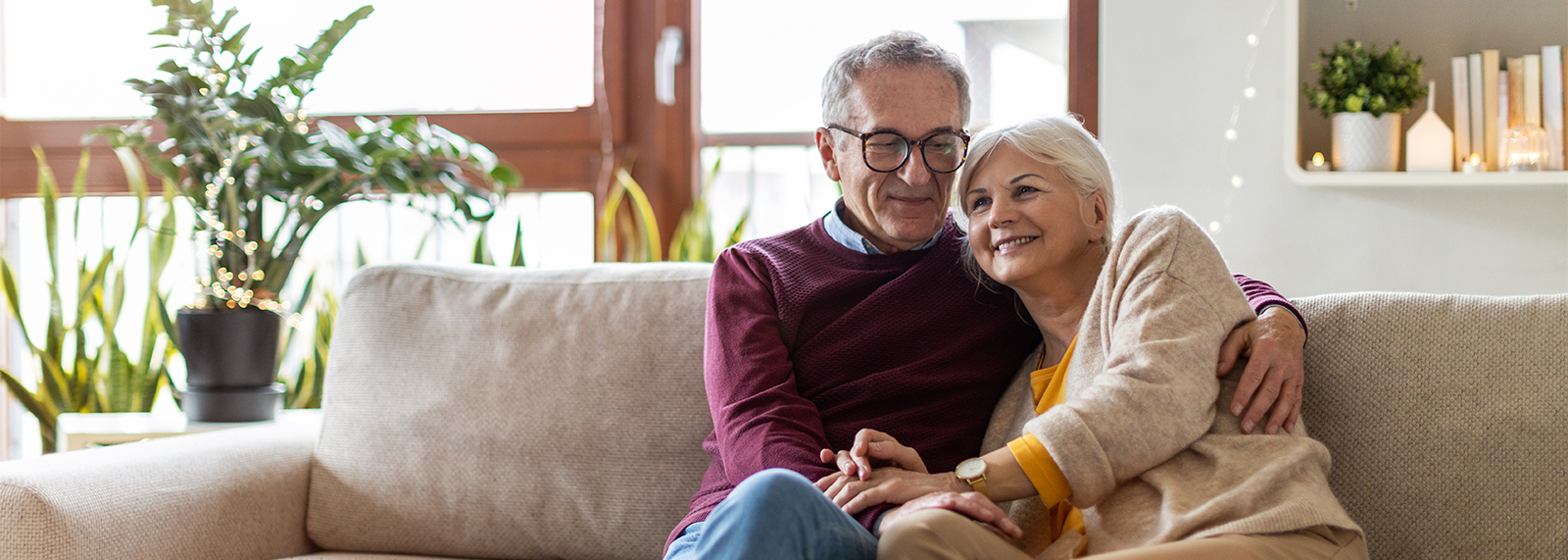 Senior couple on couch.